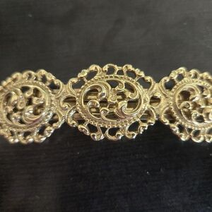 Vtg gold toned hair clip, ornate. Made in France.